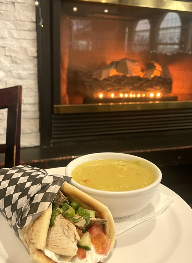 Chicken wrap with soup by the fireplace at Gus' Bar & Grill